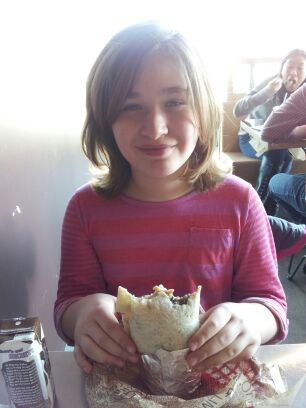 Note: this was taken a few months ago.  Her hair is longer and the burrito has been eaten.  She has her pretty going on.